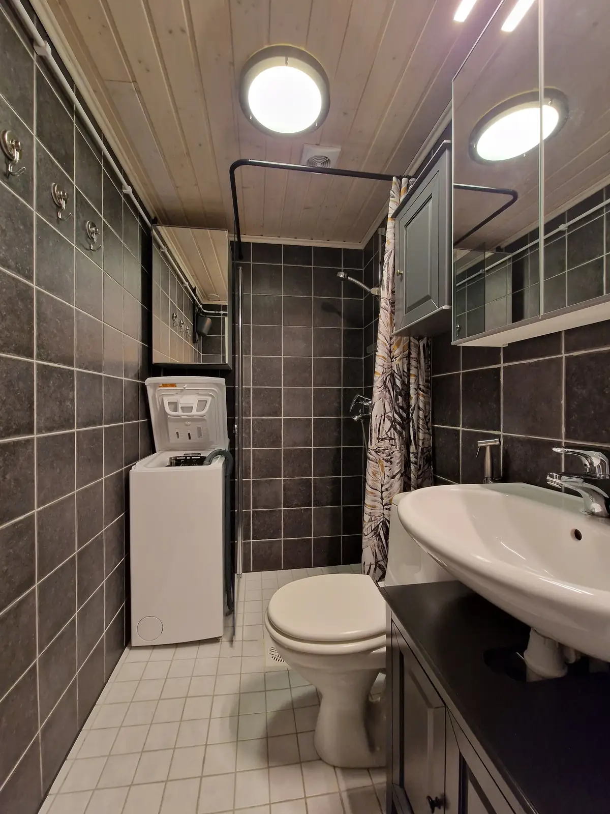 Bathroom with shower, top-loading washing machine